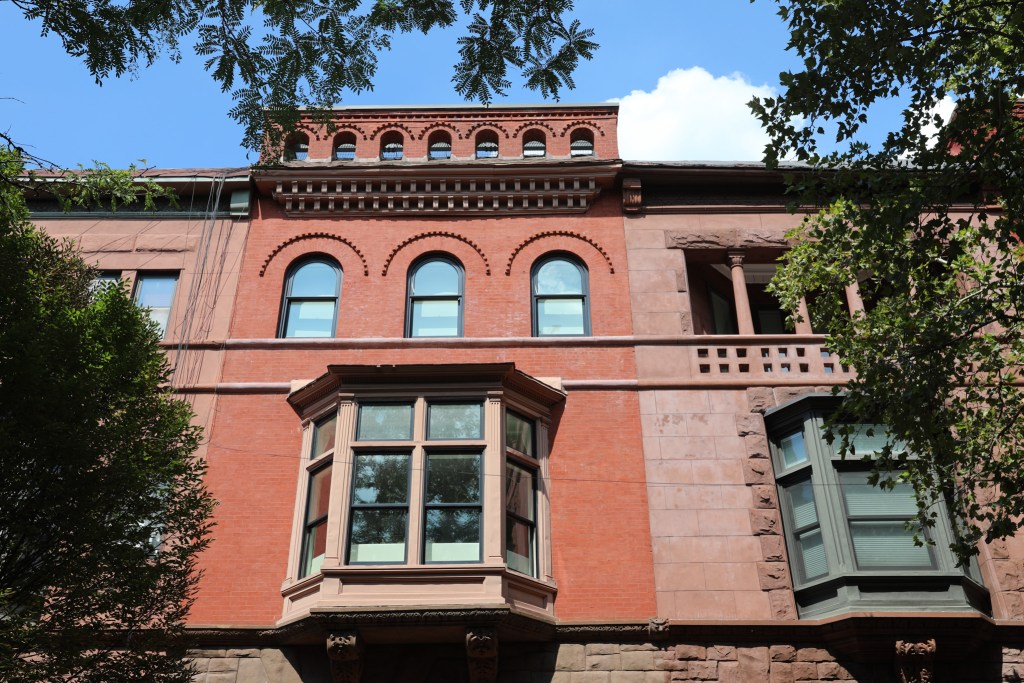 Brownstones lined a Harlem block
