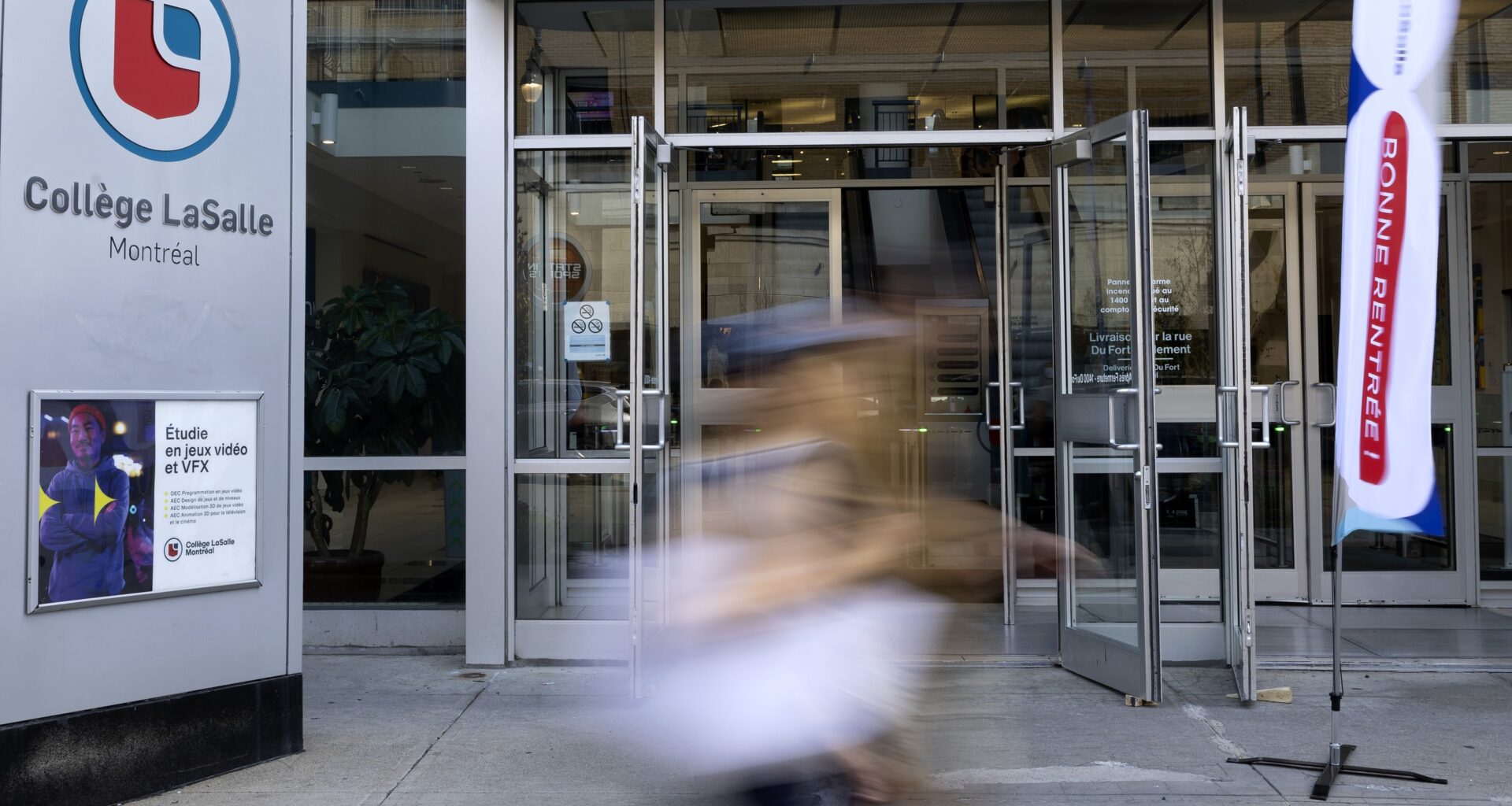 People walk past the LaSalle College building in Montreal, on Monday, Aug. 25, 2025.