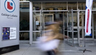 People walk past the LaSalle College building in Montreal, on Monday, Aug. 25, 2025.