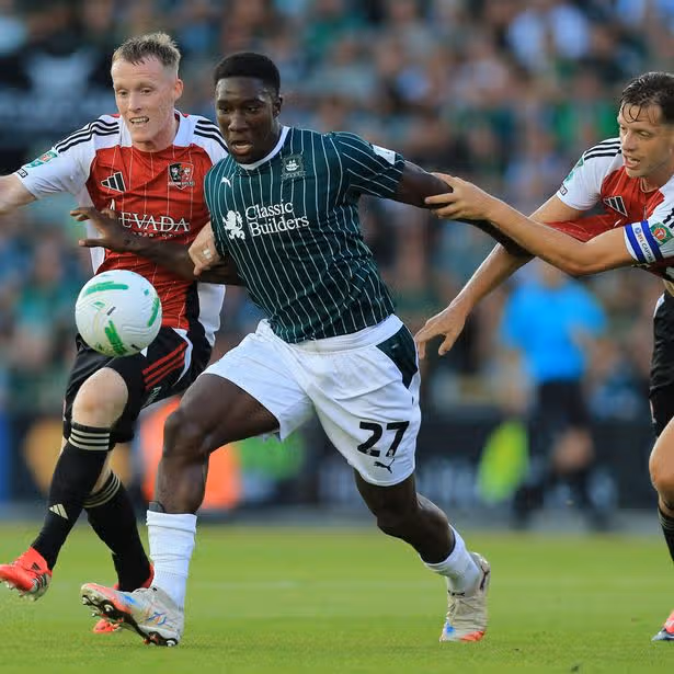 Bim Pepple of Plymouth Argyle holds off Jake Doyle-Hayes and Jack Fitzwater of Exeter City during the Carabao Cup first round match at Home Park on 10 August 2026 - Photo: Dave Rowntree/PPAUK