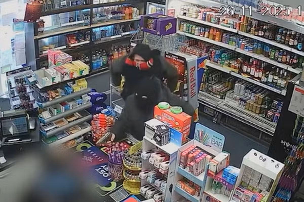 Stephen Bradley and David Oakley demanding money at gunpoint in the shop