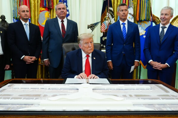 President Donald Trump speaks about Dulles International Airport modernization, in the Oval Office of the White House, Wednesday, July 29, 2026, in Washington. (AP Photo/Julia Demaree Nikhinson)