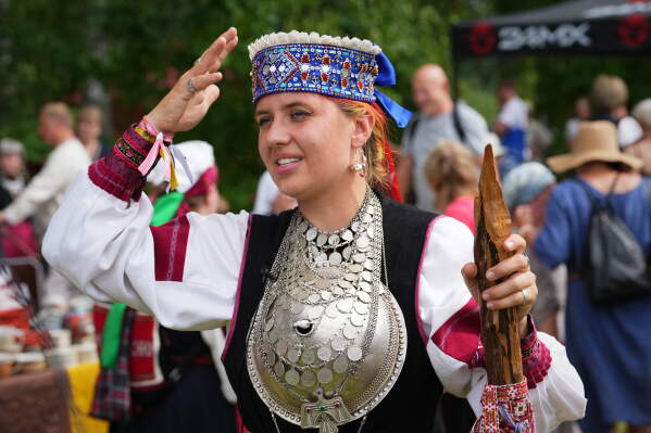 Estonia Seto Kingdom Day Maria Grünberg, a noorsootska, the representative of Seto youth, speaks during the annual Seto Kingdom Day in Mikitamäe, south Estonia, Saturday, Aug. 1, 2026. (AP Photo/Sergei Grits)