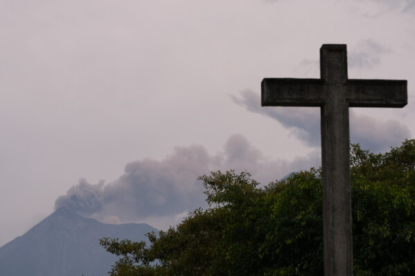 Clouds of ash spew from crater of the Fuego volcano, as seen from San Pedro Las Huertas, Guatemala, Tuesday, Aug. 4, 2026. (AP Photo/Moises Castillo)