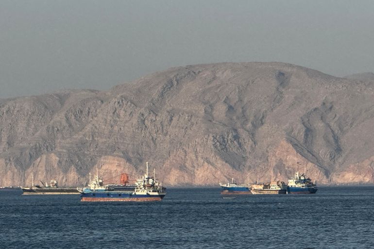 (FILES) Vessels are seen anchored in the Strait of Hormuz, off the port city of Khasab on Oman’s northern Musandam Peninsula on May 17, 2026.