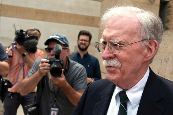 Former Trump administration national security adviser John Bolton departs the U.S. District Court in Greenbelt, Md., Friday, June 26, 2026. (AP Photo/Cliff Owen)