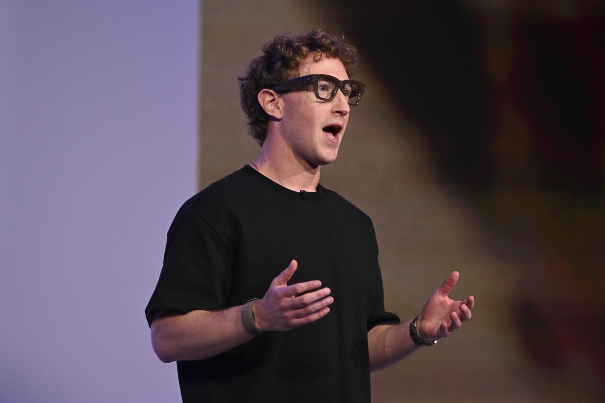 Meta CEO Mark Zuckerberg wears AI-powered smart glasses and a wristband as he speaks at the company's conference.