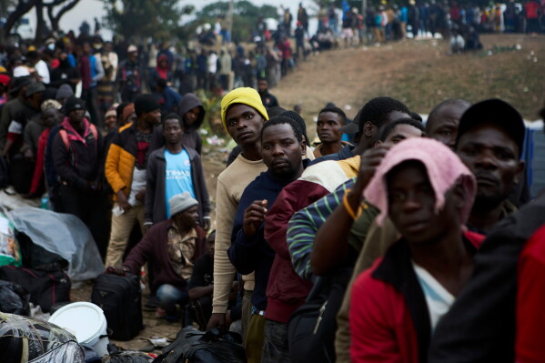 Displaced migrants queue at a deportation site, in Durban, South Africa, Wednesday, June 17, 2026. (AP Photo)