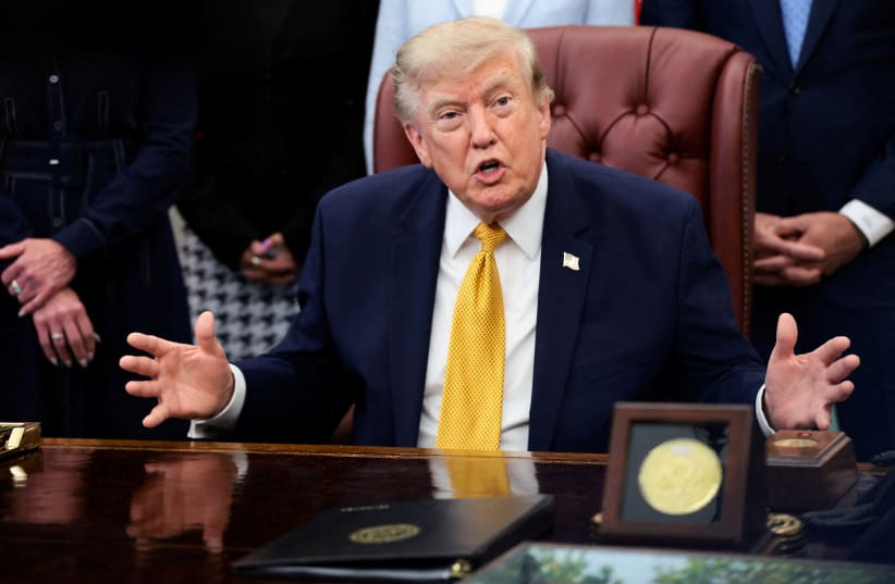 US President Donald Trump answers questions from the media after signing an executive order establishing the President's Military Spouse Commission to be chaired by Jennifer Rauchet, wife of Defense Secretary Pete Hegseth, in the Oval Office at the White House in Washington, US, August 3, 2026.