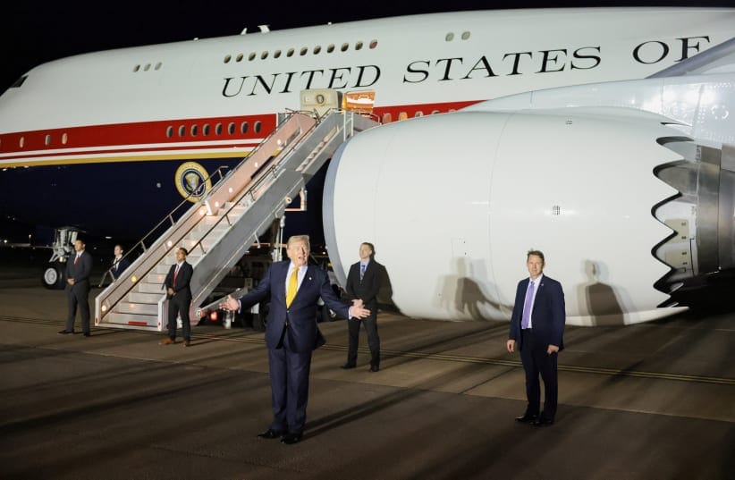 US President Donald Trump gestures during a stop to switch to the Qatari-gifted Air Force One after arriving on one of the older planes operating as Air Force One, to return to Washington after his participation in a NATO leaders summit in Turkey, at RAF Mildenhall, Britain, July 8, 2026