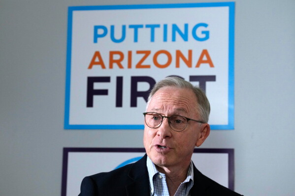 Runing mate for Democratic Arizona Gov. Katie Hobbs, Lieutenant Governor John Giles, the former Republican Mesa, Ariz., mayor, answers a question, Monday, Aug. 10, 2026, in Phoenix. (AP Photo/Ross D. Franklin)