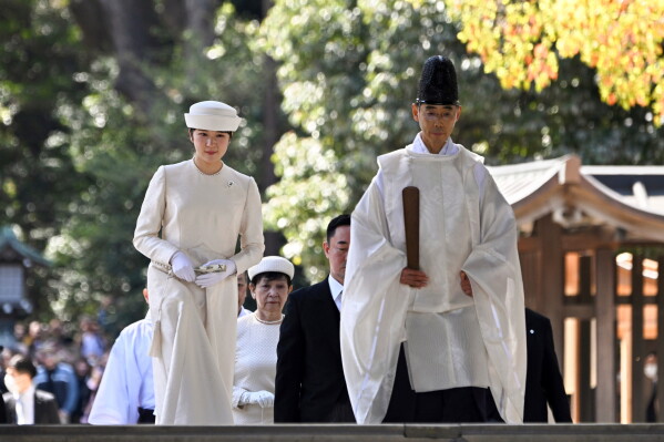 Japan's Princess Aiko, left, the daughter of Emperor Naruhito and Empress Masako, arrives to mark the 110th anniversary of the death of the wife of former emperor Meiji at Meiji Shrine in Tokyo, on April 10, 2024. (Kazuhiro Nogi/Pool Photo via AP, File)