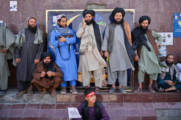Taliban government supporters attend celebrations marking the fifth anniversary of the U.S. withdrawal from Afghanistan and the Taliban's return to power, in Kabul, Afghanistan, Saturday, Aug. 15, 2026. (AP Photo/Nava Jamshidi)