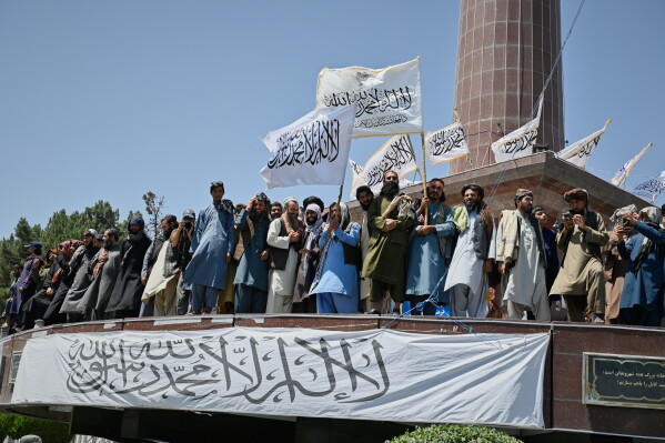 Taliban government supporters attend celebrations marking the fifth anniversary of the U.S. withdrawal from Afghanistan and the Taliban's return to power, in Kabul, Afghanistan, Saturday, Aug. 15, 2026. (AP Photo/Nava Jamshidi)
