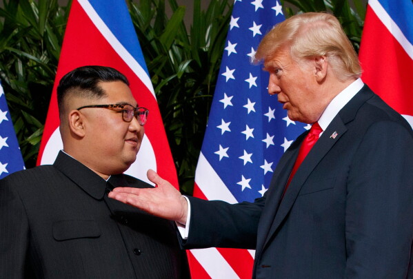 U.S. President Donald Trump, right, meets with North Korean leader Kim Jong Un on Sentosa Island in Singapore, on June 12, 2018. (AP Photo/Evan Vucci, File)