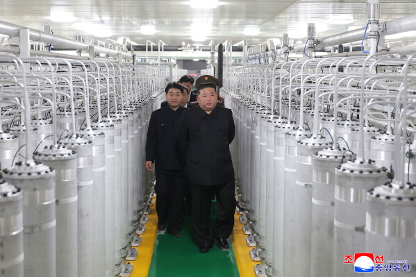 In this photo provided by the North Korean government, its leader Kim Jong Un, front right, visits a new facility to produce nuclear bomb fuels at an undisclosed place in North Korea Wednesday, June 3, 2026. Independent journalists were not given access to cover the event depicted in this image distributed by the North Korean government. The content of this image is as provided and cannot be independently verified. Korean language watermark on image as provided by source reads: "KCNA" which is the abbreviation for Korean Central News Agency. (Korean Central News Agency/Korea News Service via AP)