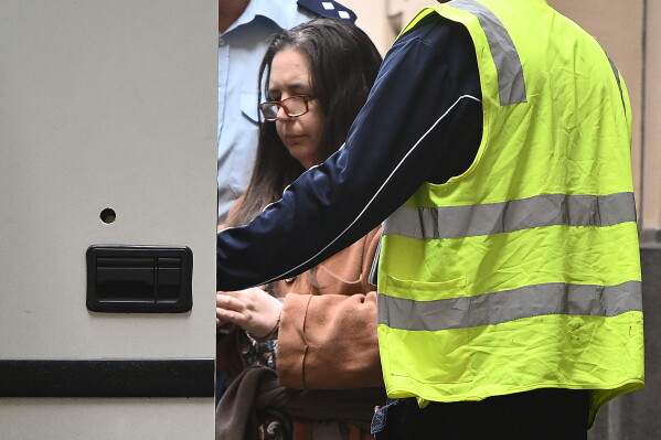 Erin Patterson is escorted away from the Supreme Court of Victoria in Melbourne, Australia, on Sept. 8, 2025. (Joel Carrett/AAP Image via AP, File)