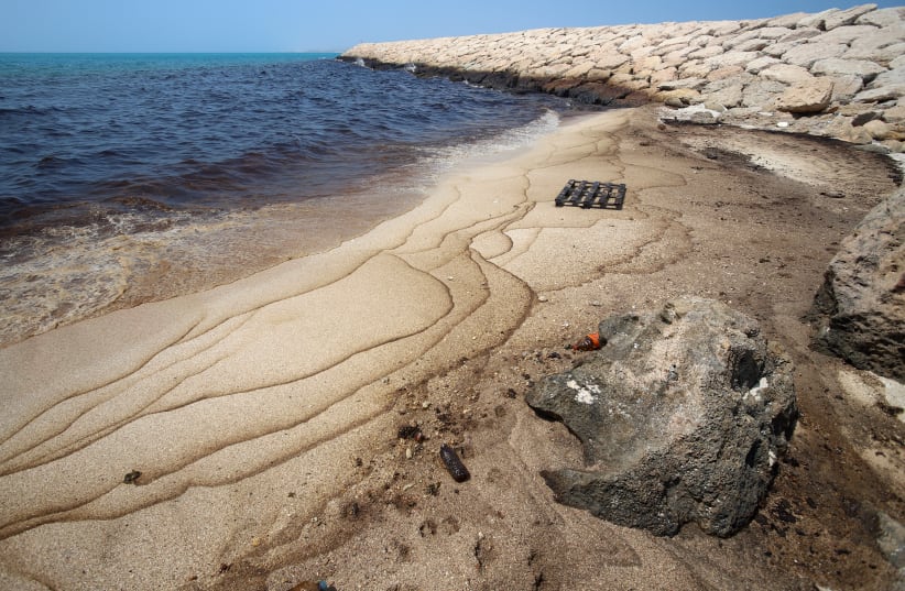 This photograph obtained from Iran's ISNA news agency on August 13, 2026 shows an oil slick along the southern coast of Qeshm Island, Iran, August 13, 2026. 