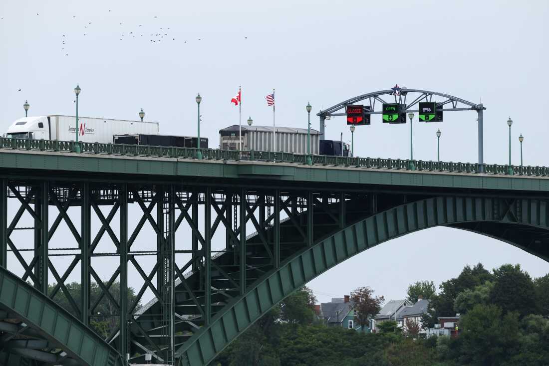 Tractor trailers cross the Peace Bridge at the Canada-United States border in Fort Erie, Ontario, Canada, on Aug. 20.