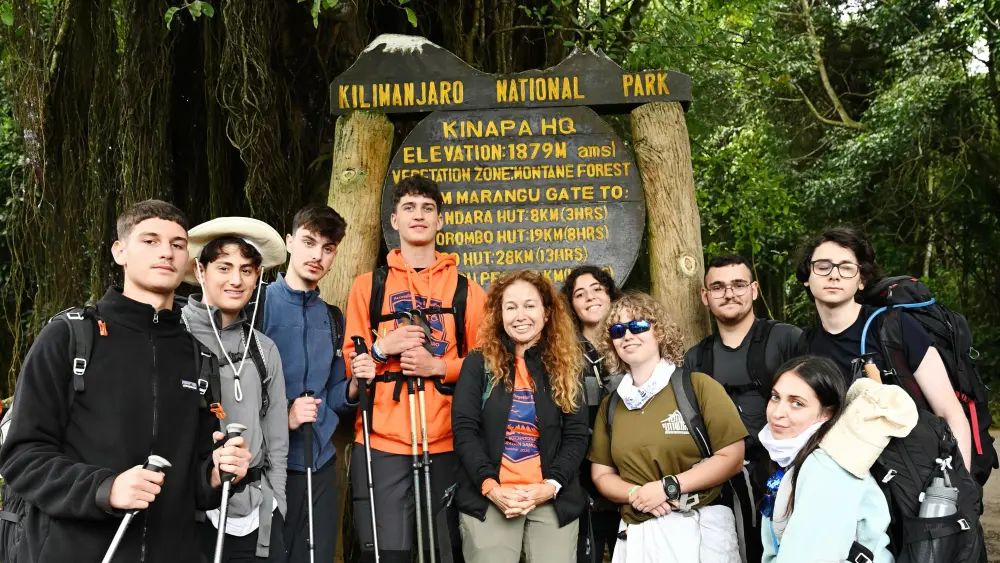 Members of Jeremy’s Circle gather at Marangu Gate before beginning their ascent of Mount Kilimanjaro, July 2026. Credit: Accessibility Accelerator.
