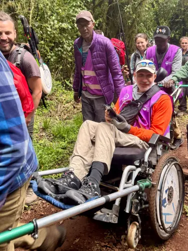 Abu El Haj Mahmoud makes his way toward the Mandara Huts along Mount Kilimanjaro’s Marangu Route, July 2026. Credit: Accessibility Accelerator.