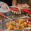 A worker at Monchy's prepares a taco order for a customer at the restaurant in Houston, Texas, on July 11, 2026.