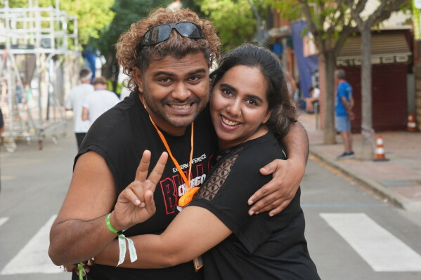 Revelers Vigu, left, and Megha from India pose for a picture ahead of the annual "Tomatina" tomato fight fiesta, in the village of Bunol near Valencia, Spain, Wednesday, Aug. 26, 2026. (AP Photo/Alberto Saiz)