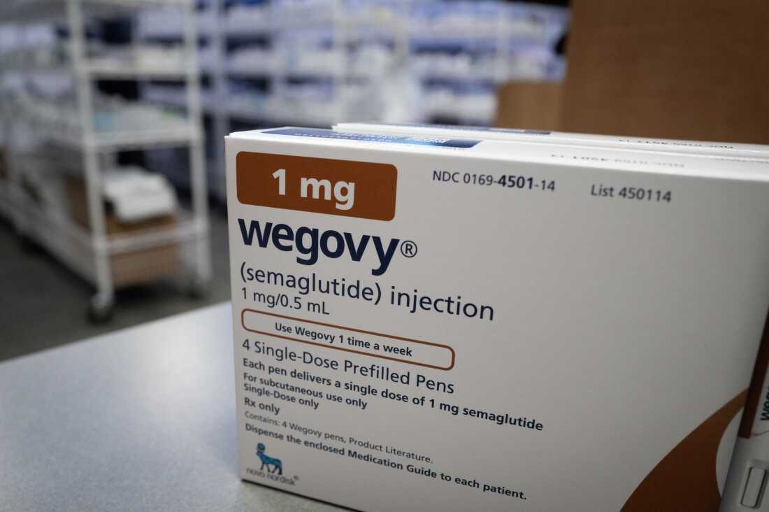 A box of Wegovy, an obesity drug, sit on a pharmacy counter.