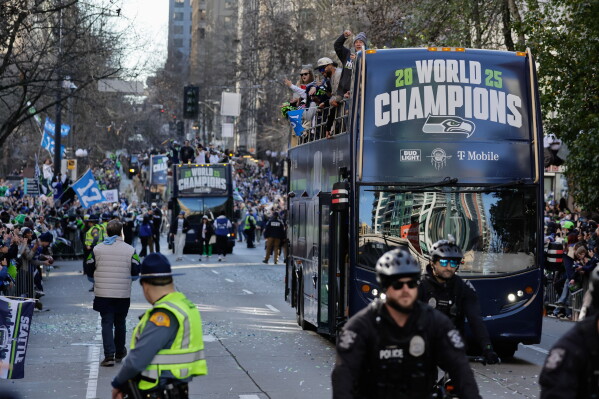 Seattle Seahawks players take part in the team's NFL football Super Bowl 60 parade and celebration, Wednesday, Feb. 11, 2026, in Seattle. (AP Photo/John Froschauer,File)