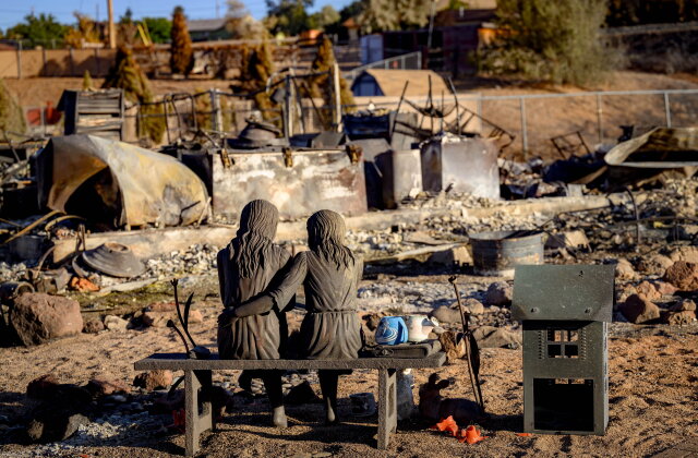 TOPSHOT - A statue is left amid the remains of a home burned by the Hawk Fire in Reno, Nevada on August 24, 2026. Tens of thousands of people looked set to spend another night away from home on August 24 as a wind-driven fire bore down on the western US city of Reno. Schools were shuttered as smoke swathed the city in Nevada, near the California border, home to around 280,000 people.
Around 24,000 were still under evacuation orders on Monday, officials said, down from over 40,000 at its peak. (Photo by Josh Edelson / AFP via Getty Images)