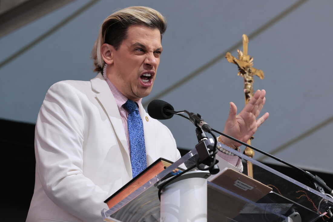 FILE — British far-right political pundit Milo Yiannopoulos hosts the ‘Bishops Enough Is Enough’ rally at the MECU Pavilion November 16, 2021 in Baltimore, Maryland. Organized to coincide and run counter to the U.S. Conference of Catholic Bishops at the nearby Marriott Baltimore Waterfront, the conservative prayer meeting and convention was organized by the far-right Catholic news outlet Saint Michael’s Media, also known as Church Militant.