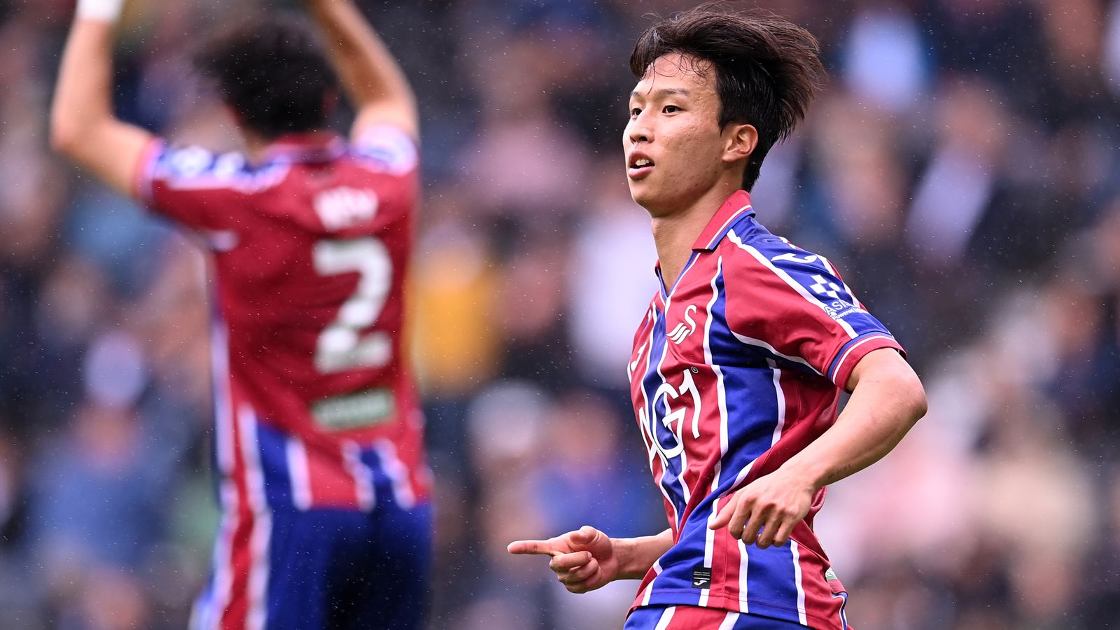 Swansea's Ji-Sung Eom celebrates scoring their second goal