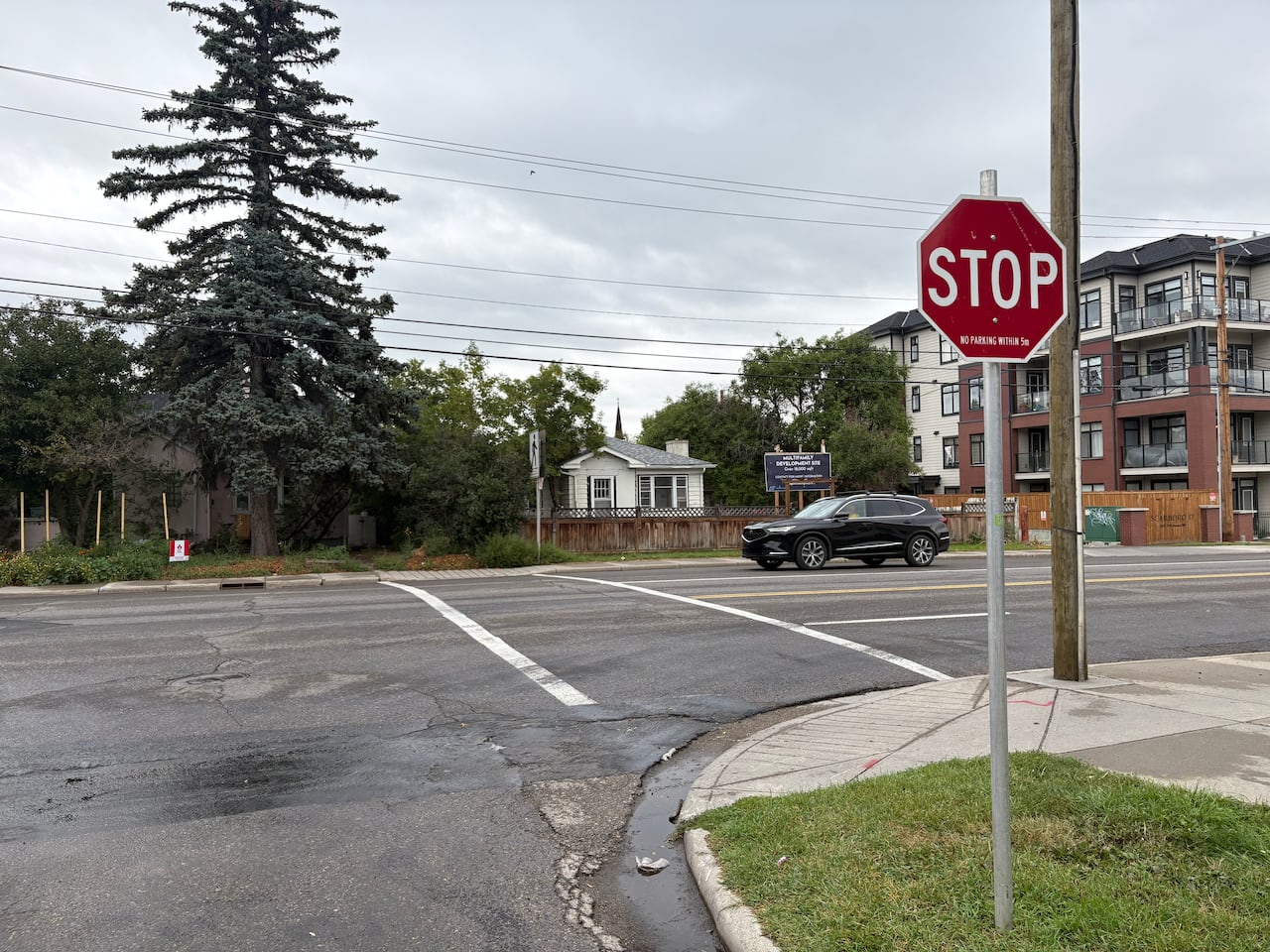 A car drives through an intersection