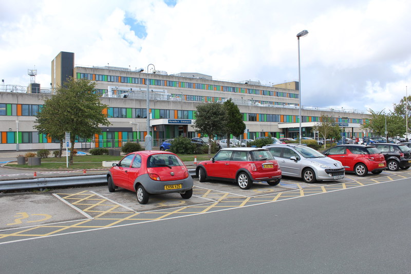 The Ysbyty Glan Clwyd hospital with a parking lot in the foreground.
