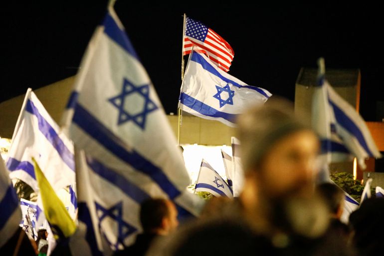 Israeli protesters attend a right-wing demonstration in support of Israel’s nationalist coalition government and its judicial overhaul, in Tel Aviv, Israel, March 30, 2023