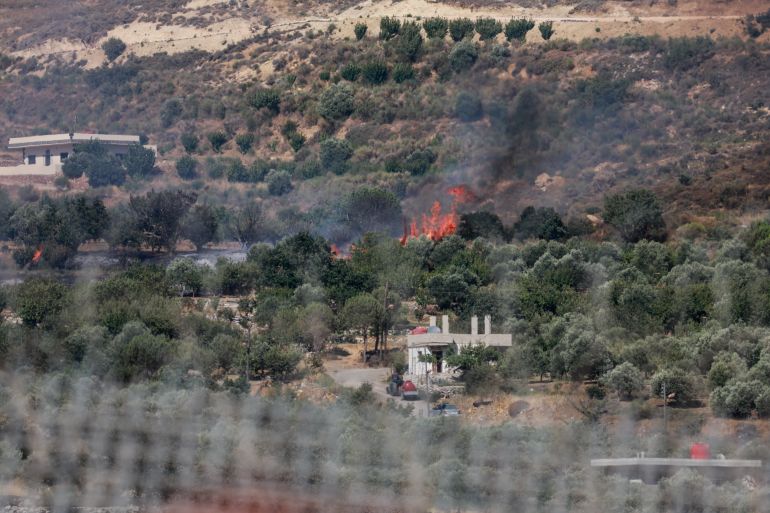 A fire is seen on Syrian side, amid the conflict in the Druze areas in Syria, seen from Majdal Shams, near the ceasefire line between the Israeli-occupied Golan Heights and Syria, July 16, 2025 [Ammar Awad/Reuters]