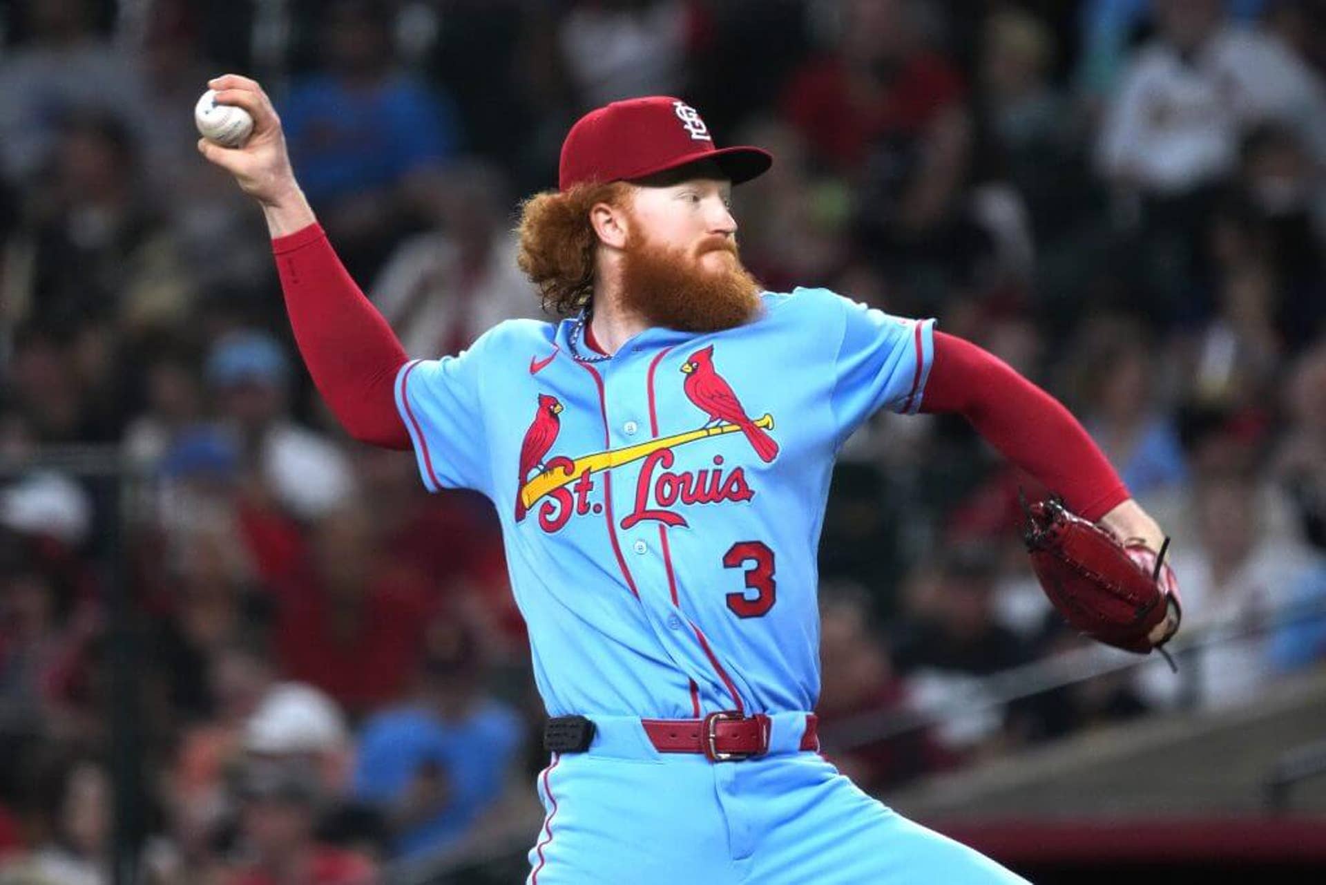 Dustin May, with his flowing red hair and beard, pitches against the Arizona Diamondbacks on July 18.