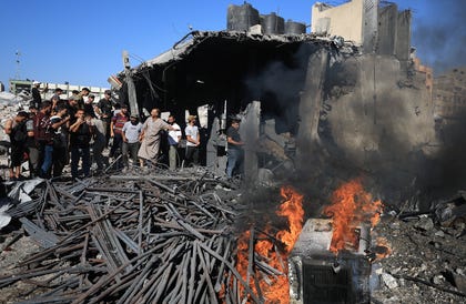 Palestinians inspect the site of an Israeli strike on a water desalination plant, carried out after the Israeli military warned residents to evacuate the area, in Gaza City, August 24, 2026.