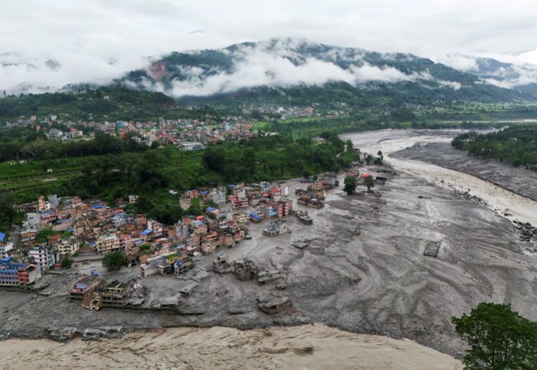 A drone view shows mud covering properties following a flash flood in Trishuli, Nuwakot district, Nepal, August 27, 2026. REUTERS/Navesh Chitrakar