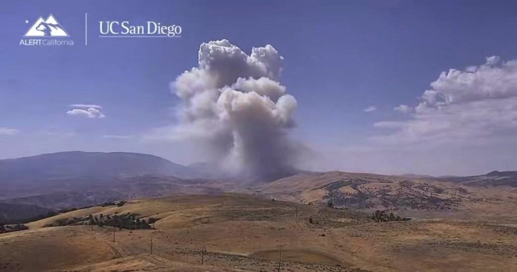 Large plumes of smoke rising from the Ridge Fire in northern Los Angeles County.