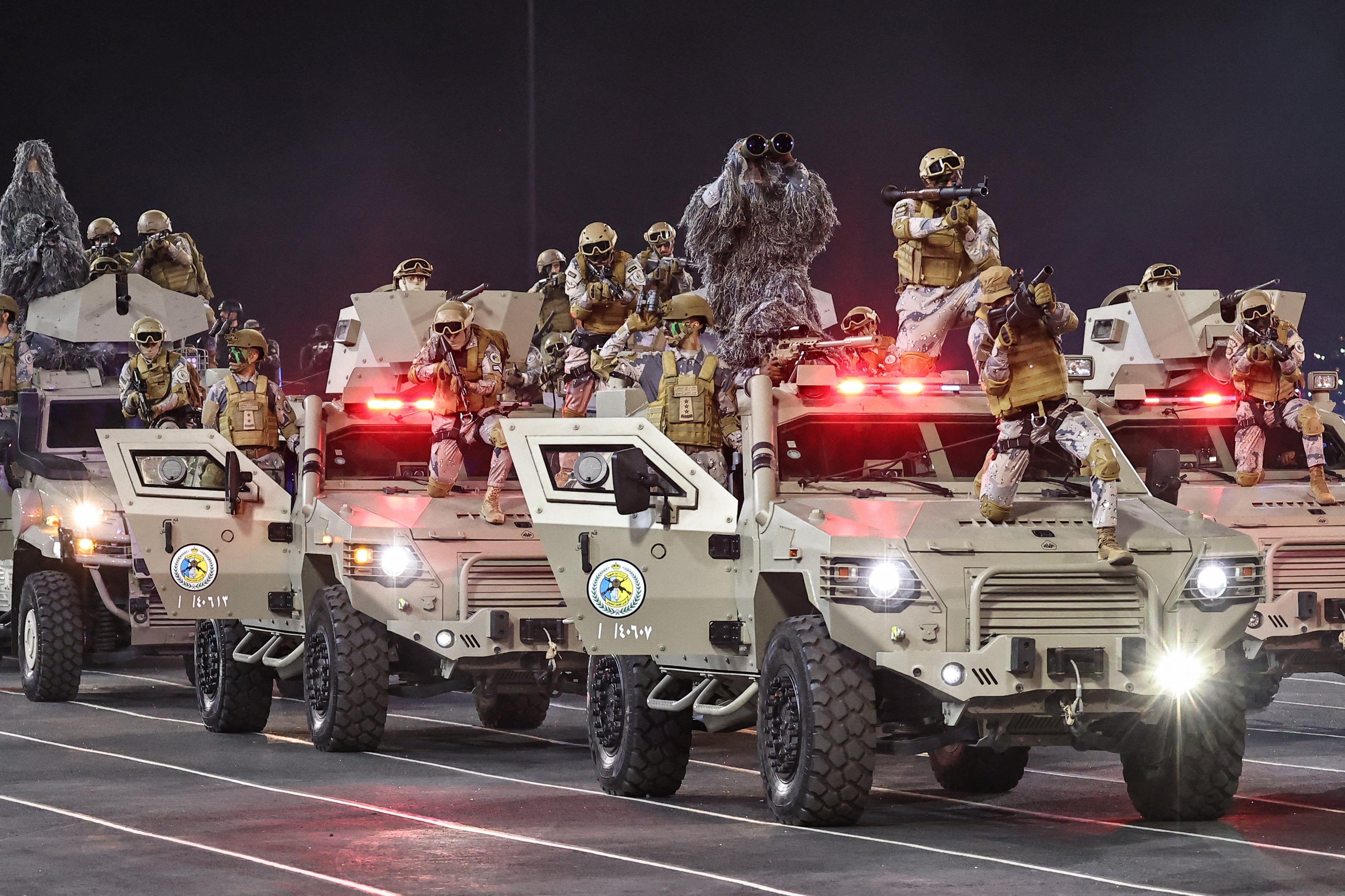 Members of the Saudi security forces take part in a military parade ahead of the Hajj pilgrimage in Mecca on May 21