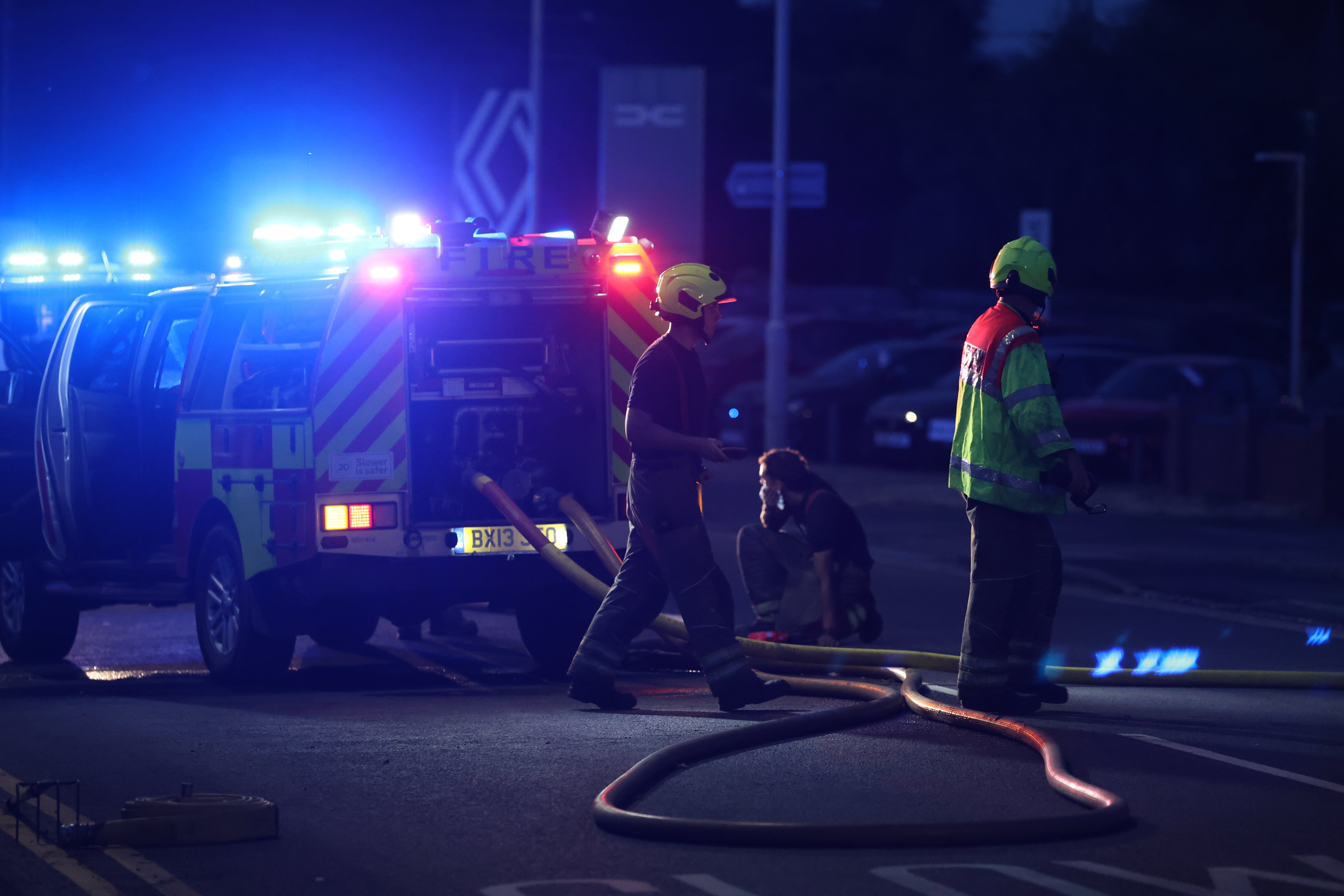 Firefighters attend as a wildfire spreads to homes in Stourbridge