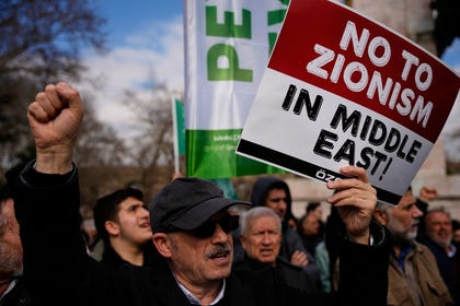 People protesting against U.S. and Israeli strikes on Iran, in Istanbul, March. Credit: Emrah Gurel/AP People protesting against U.S. and Israeli strikes on Iran, in Istanbul, March.
