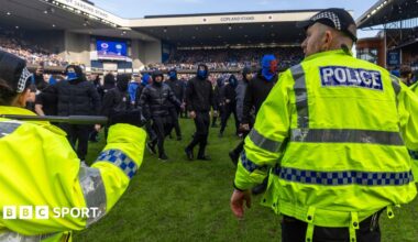 Rangers supporters confront police officers after last season's Scottish Cup quarter-final defeat by Celtic