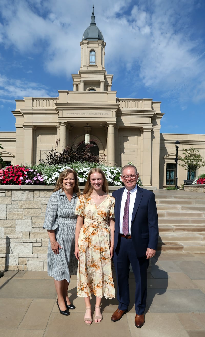 Nicole Sender, center, poses with her parents Joan and Doug following the dedication ceremony of the Cleveland Ohio Temple in Independence, Ohio, on Sunday, Aug. 16, 2026.