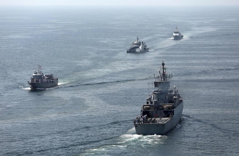Warships sail during the joint Navy exercise of Iran, China and Russia in the Gulf of Oman, Iran, March 12, 2025. 