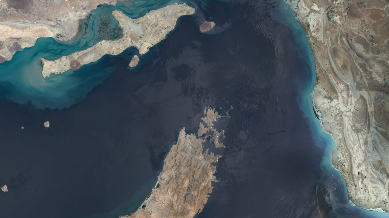 STRAIT OF HORMUZ, OMAN/IRAN -- JUNE 16, 2026: 01 -- Maps4media-processed Sentinel-2 satellite imagery shows a broad overview of the Strait of Hormuz, including the Musandam Peninsula, nearby islands, coastal shallows, and the narrow maritime corridor linking the Persian Gulf with the Gulf of Oman.