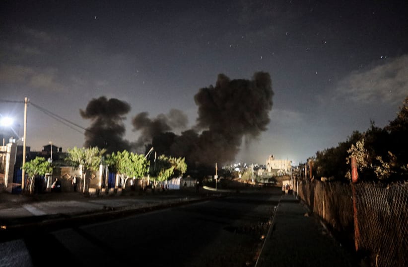 Illustrative: Black smoke rises at night after a residential block was targeted west of the Nuseirat Refugee Camp in the central Gaza Strip on July 15, 2026.