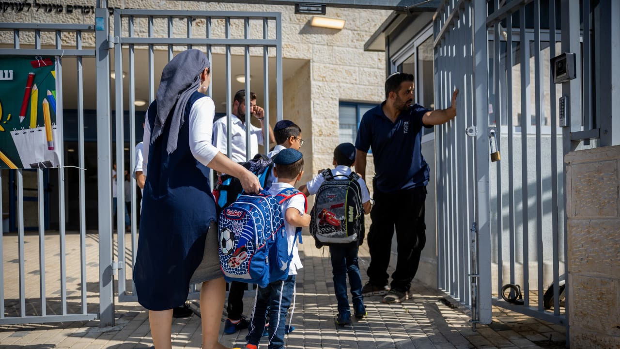 Young students arrive to the classroom at the opening of the new school year in a school for ultra orthodox jewish boys, in Beit Shemesh, August 28, 2022.
