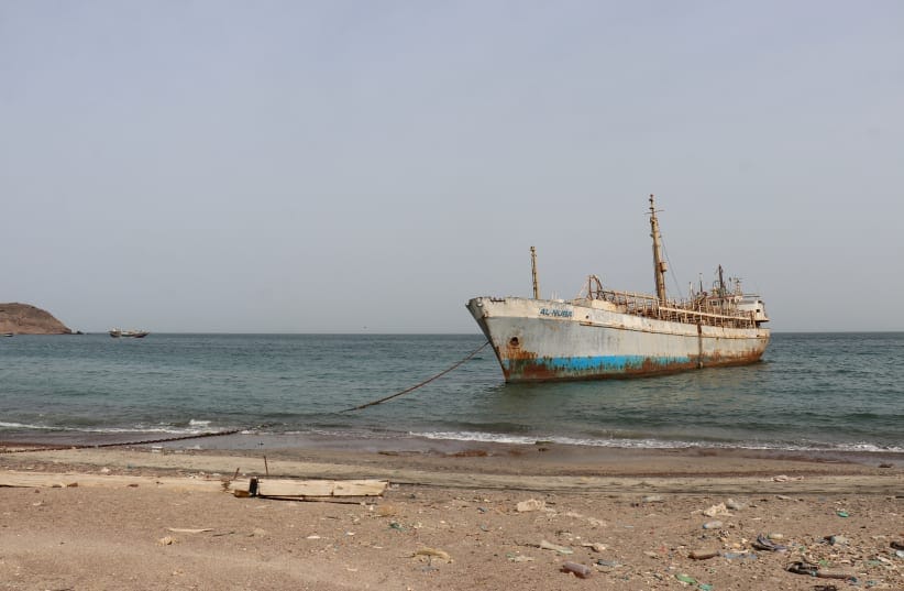 A photo taken from the Yemeni coast southwest of the city of Taiz, shows a vessel anchored at Bab al-Mandab Strait, in the Red Sea, on July 24, 2026.